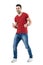 Cheerful excited young man in red t-shirt showing thumbs up gesture.