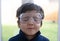 Cheerful exited little boy wearing protective glasses  and closing eyes with smiling face, Cute kid wearing safety glasses. Protec