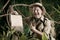 Cheerful explorer with sign