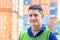 Cheerful factory worker man smiling and looking at camera with joy, Happiness concept