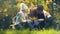 Cheerful family embracing school aged daughter in autumn park, perfect weekend