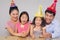 Cheerful family of four playing with firecrackers