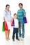 Cheerful family giving shopping bags