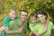 Cheerful family in green shirts