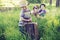 Cheerful family playing on tall grass