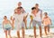 Cheerful family on sandy beach