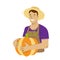 Cheerful Farmer in a straw hat holds a large Pumpkin in his hands.
