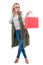 Cheerful fashionable girl holding shopping bag