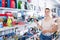 Cheerful female buying products in stationery shop