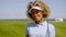 Cheerful female golfer walking with golf club