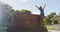 Cheerful Female Hiker Standing By Diamond Head State Monument Sign