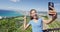 Cheerful Female Hiker Taking Selfie Against Waikiki Beach And Honolulu