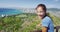 Cheerful Female Hiker Waving On Observation Point At Diamond Head State Monument