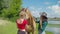 Cheerful female learning to ride horse outdoors