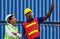 Cheerful female shipping company smiling with arms crossed, worker man point to the sky, with clipping path