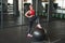 Cheerful female stepping on exercise ball