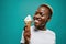 Cheerful female in white shirt and eating cold ice cream