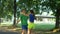 Cheerful fit woman encouraging runner outdoors