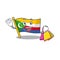 Cheerful flag comoros cartoon character waving and holding Shopping bag