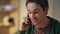 Cheerful freelancer phone call speaking at office closeup. Emotional man talking