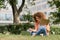 cheerful freelancer woman with curly hair