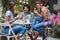 Cheerful friends enjoying snack at the bar`s backyard. Quality friendship time together