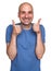 Cheerful funny bald man shows his thumbs up