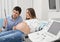 Cheerful future parents looking at ultrasound image of baby