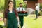 Cheerful gardener enjoying work in garden