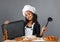 Cheerful girl chef holding the menu board