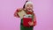 Cheerful girl Christmas Santa Claus Elf getting present gift box, expressing amazement happiness