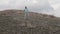 Cheerful girl dancing on the mountain