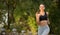 Cheerful girl running in park, healthy lifestyle