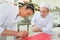 Cheerful girl at training school making cake