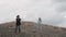 Cheerful girls dancing on the mountain