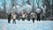 Cheerful girls throw snow on the background of a snow-covered forest.