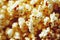 Cheerful golden yellow caramel popcorn flakes attract appetite.