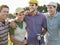 Cheerful Golfers On Golf Course