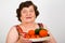 Cheerful grandma holding fresh vegetables