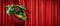 cheerful green dragon peeking out from behind the red curtain of the theater wings. Symbol of 2024 according to eastern calendar