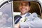 Cheerful groom in suit looking at