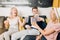 Cheerful group of friends eating popcorn at home