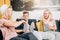 Cheerful group of friends eating popcorn at home