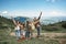 Cheerful group of tourists are spending great time in mountains