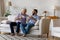 Cheerful grownup son and happy senior father enjoying coffee break