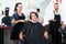 Cheerful hairdresser cutting female client