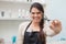 Cheerful hairdresser looking at camera