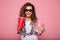 Cheerful happy lady with cola and popcorn wearing 3d glasses