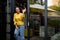 Cheerful happy satisfied smiling businesswoman or businessperson after a successful meeting. Adult person at the door of it`s