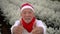 Cheerful happy thumbs up Asian senior man with red scraft and Christmas Santa Claus